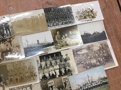 Lot 1136 - Postcards - Military including WW1, real photographic cards, camp life, sports teams, bands, portraits, hospital groups, parades, silks, airship  etc. Loose in shoe box.