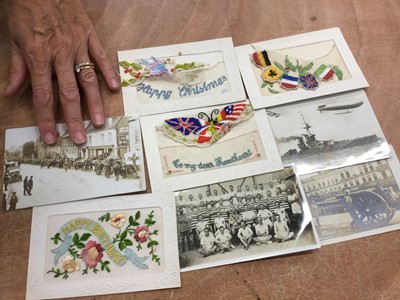 Lot 1136 - Postcards - Military including WW1, real photographic cards, camp life, sports teams, bands, portraits, hospital groups, parades, silks, airship  etc. Loose in shoe box.