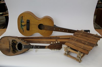 Lot 1888 - Collection of four instruments to include an Appalachian three string dulcimer, a square neck slide guitar, a Neapolitan bowl back mandolin by F.D. Mureda, and a one octave African balafon