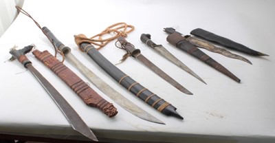 Lot 772 - Borneo Dayak Head hunters sword, together with a group of four other Eastern swords and daggers (5)