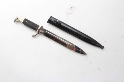 Lot 773 - Second World War Nazi Dress / Parade bayonet with poilished steel blade by WKC (retaining all original polish), cherquered plastic grip and chrome plated fittings, in black steel scabbard