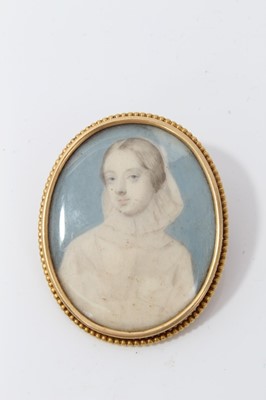 Lot 250 - 19th century ivory portrait miniature in gilt metal brooch mount