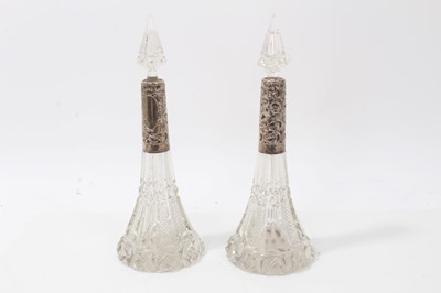 Lot 304 - Pair of cut glass scent bottles with silver mounts (Birmingham 1915)