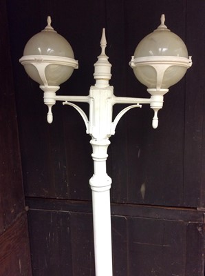 Lot 401 - Set of four Parisienne style white painted metal floor standing lamp posts