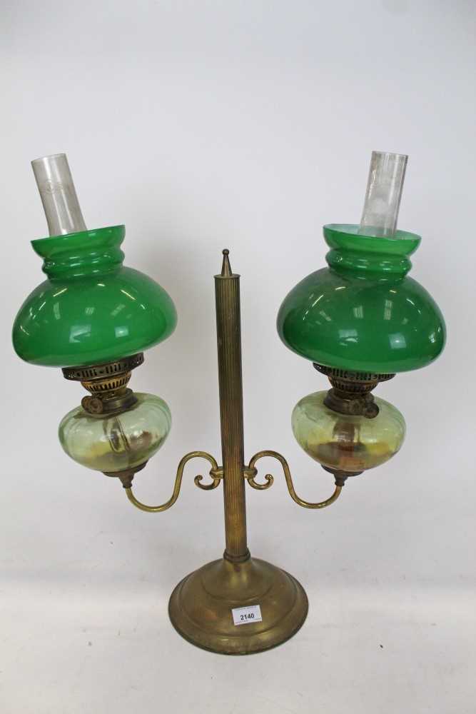 Lot 2140 - Brass library lamp with green shades