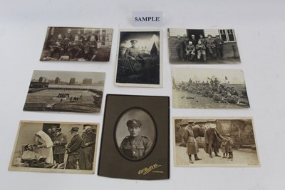 Lot 1214 - Postcards - good quantity of WW1 military real photographic cards, identified camps and groups, trenches, teams, coloured vignette, other cards including damage to SS St Paul, Life Boat Bury St Edm...