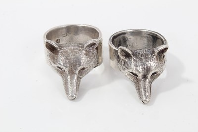 Lot 257 - Two silver fox mask rings