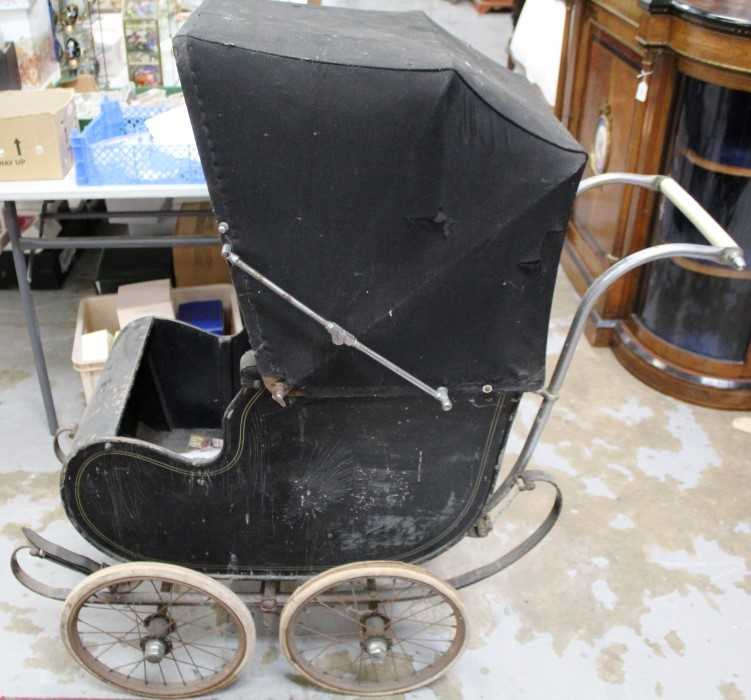 Lot 2158 - Early 20th Century pram with wire wheels, black painted wooden body and canvas hood, by Hitchings of London