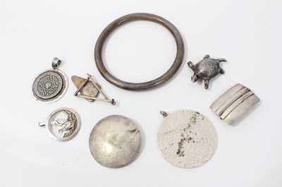 Lot 267 - Silver bangle, silver tortoise brooch, two other silver brooches and four silver pendants