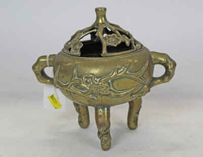 Lot 330 - Chinese Brass Censor with raised flowering prunus decoration, raised on three legs, with character marks to base
