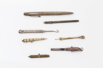 Lot 282 - Silver pen, novelty propelling pencil in the form of a cannon with inscription from the members of The Harbour Trust  Battery 31st March 1887, other pencils and a Hackney Empire Theatre button hook...