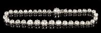 Lot 603 - Diamond bracelet with a continuous line of...