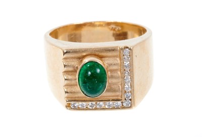 Lot 433 - 18ct gold signet ring with an oval cabochon emerald and diamond set bezel