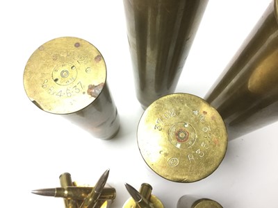 Lot 218 - Pair of First World War brass trench art vases marked Ypres, raised on bases constructed from bullets, together with other brass trench art vases, two carved nut Netsukes