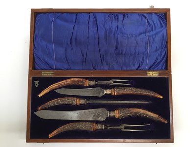 Lot 267 - Edwardian five piece carving set with antler handles and silver ferrells, in original fitted case (Sheffield 1907)