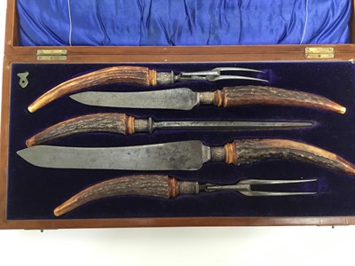 Lot 267 - Edwardian five piece carving set with antler handles and silver ferrells, in original fitted case (Sheffield 1907)