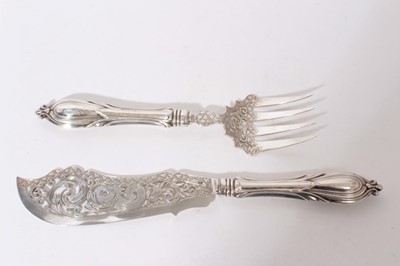 Lot 313 - Pair of Good Quality Victorian silver fish servers with ornate pierced decoration depicting a classical Dolphin amongst scrolls and foliate engraved borders