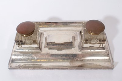 Lot 320 - Edwardian silver inkstand of rectangular form with twin pen rests, central three division stamp box with hinged lid and two cut glass inkwells with brass hinged covers, (Birmingham 1907)