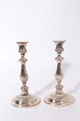 Lot 375 - Pair of Regency silver plated candlesticks with oval fluted stems