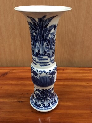 Lot 112 - 19th Century Chinese Porcelain vase of Gu form with blue and white decoration and four character mark to base, 24.5cm overall height