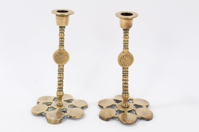 Lot 674 - Pair of brass Asthetic movement candlesticks