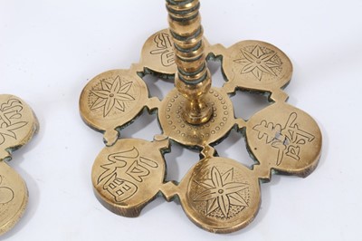 Lot 674 - Pair of brass Asthetic movement candlesticks