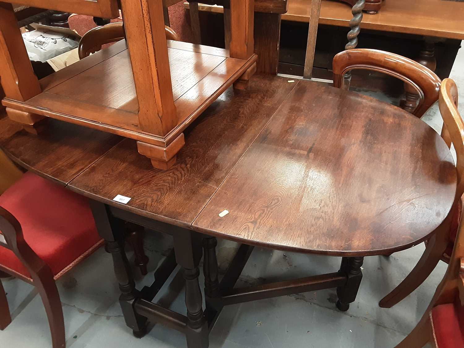 Lot 957 - Oak drop leaf dining table