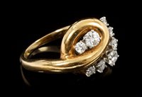 Lot 648 - Diamond dress ring with a polished yellow gold...