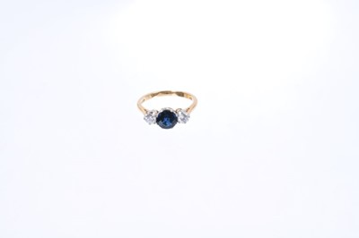 Lot 522 - Sapphire and diamond three stone ring