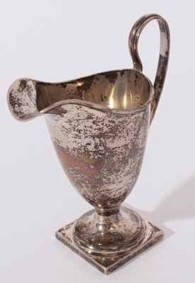 Lot 203 - Edwardian silver cream jug of helmet form with loop handle (Birmingham 1905) together with a 1920's silver christening mug (Birmingham 1929)