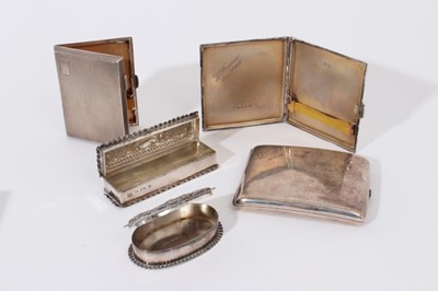 Lot 206 - Late Victorian silver trinket box of rectangular form with hinged cover and embossed decoration (Birmingham 1901) together with another similar of oval form (Birmingham 1903)