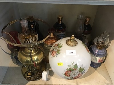 Lot 249 - Group of Wade Whisky Decanters, oil lamps, and Wade Veteran cars tankards