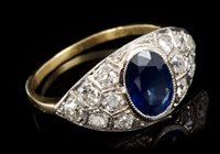 Lot 662 - Sapphire and diamond ring with an oval mixed...