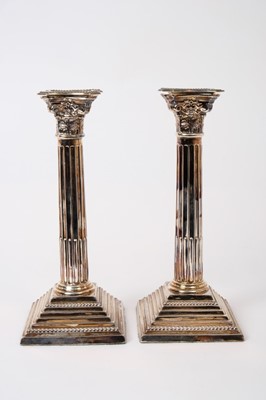 Lot 337 - Pair silver Corinthian column candlesticks (London 1962), weighted, 24cm