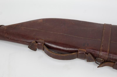 Lot 828 - An early 20th century leather leg ‘o mutton gun case, 79cm long