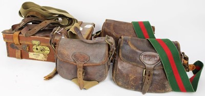 Lot 835 - Three leather cartridge bags, leather and canvas covered cartridge magazine and four spare leather and canvas bag straps (8 items)