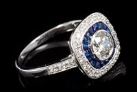 Lot 681 - Diamond and sapphire ring, the central...