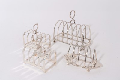 Lot 338 - Four silver toast racks