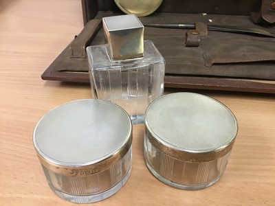 Lot 288 - Early 20th century silver mounted and glass toiletry set in original fitted case, together with another silver topped pot and other accessories