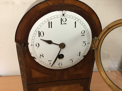 Lot 291 - Late 19th century inlaid mahogany mantel clock with circular white enamel dial, in dome topped case with brass carrying handle, on four brass ball feet, 26cm high