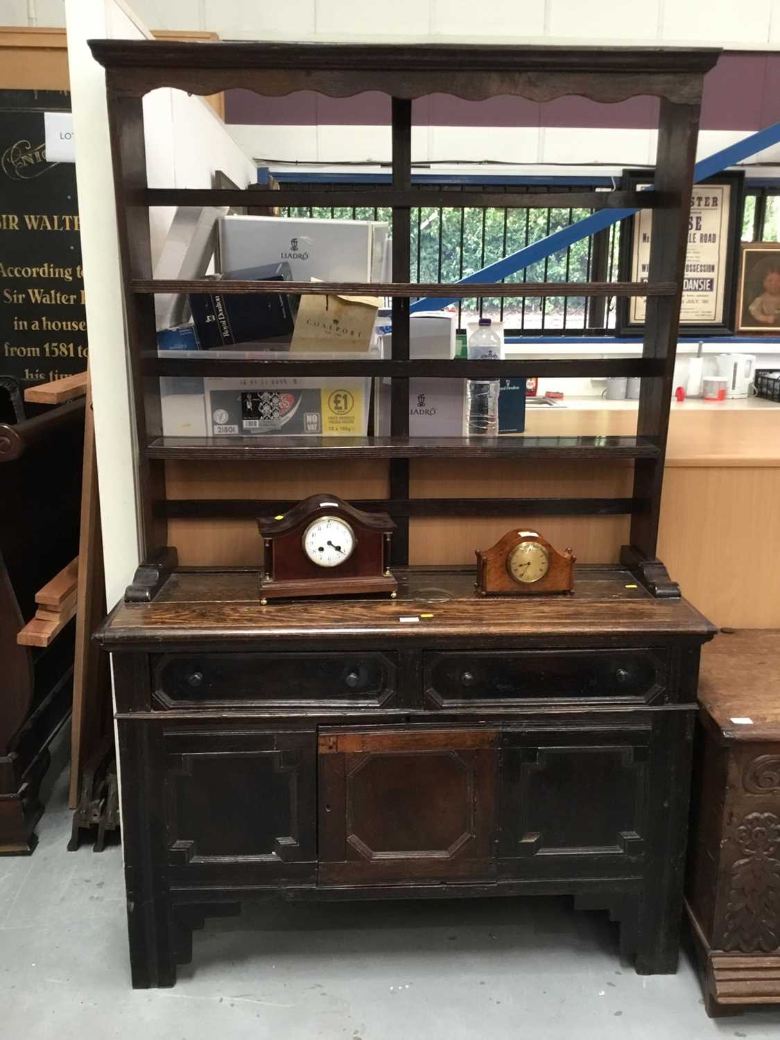 Lot 881 - Antique oak dresser with plate rack above, two drawers and panelled doors with geometric mouldings