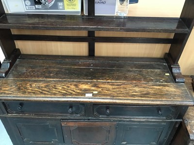 Lot 881 - Antique oak dresser with plate rack above, two drawers and panelled doors with geometric mouldings