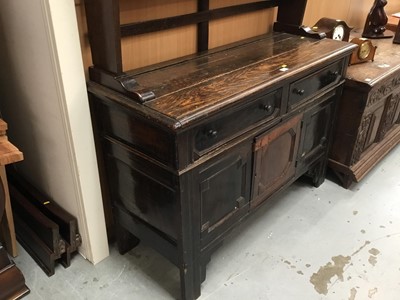 Lot 881 - Antique oak dresser with plate rack above, two drawers and panelled doors with geometric mouldings