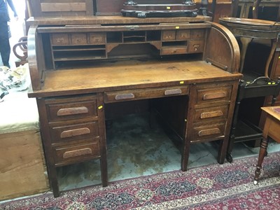 Lot 951 - Edwardian oak roll top desk