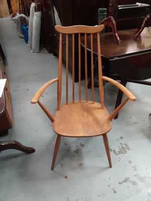 Lot 920 - Two Ercol light elm stick back chairs