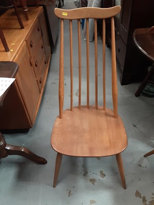 Lot 920 - Two Ercol light elm stick back chairs