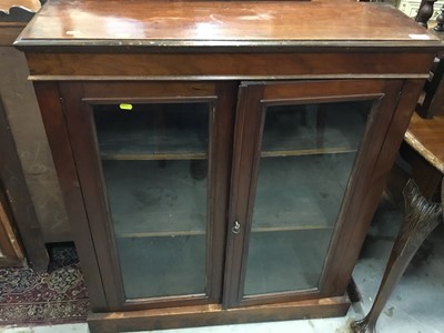 Lot 1026 - Victorian mahogany two height bookcase with two glazed door and shelves below, together with another Victorian bookcase enclosed by two glazed doors