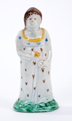 Lot 50 - Prattware figure of a young woman, c.1800