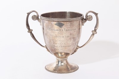 Lot 294 - George V Irish silver trophy cup of inverted bell form with twin scroll handles with engraved inscription 'St Margaret's Folkstone', raised on pedestal foot, (Dublin 1913