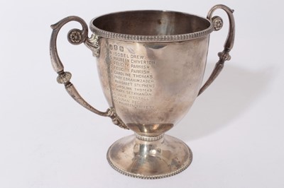 Lot 294 - George V Irish silver trophy cup of inverted bell form with twin scroll handles with engraved inscription 'St Margaret's Folkstone', raised on pedestal foot, (Dublin 1913